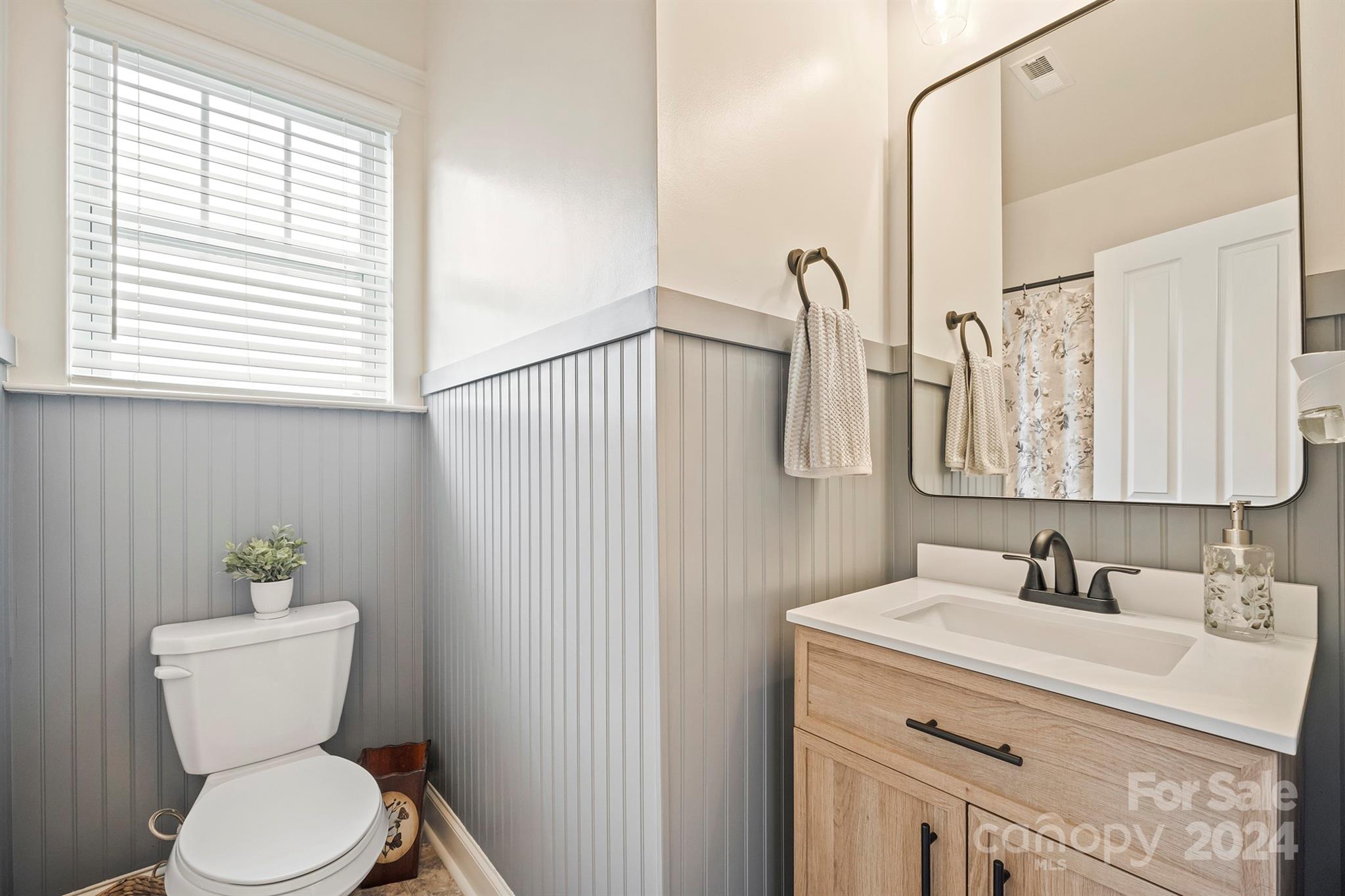 13516 Stumptown Road Huntersville, NC 28078 - Photo 24 of 37 a bathroom with a toilet sink and mirror