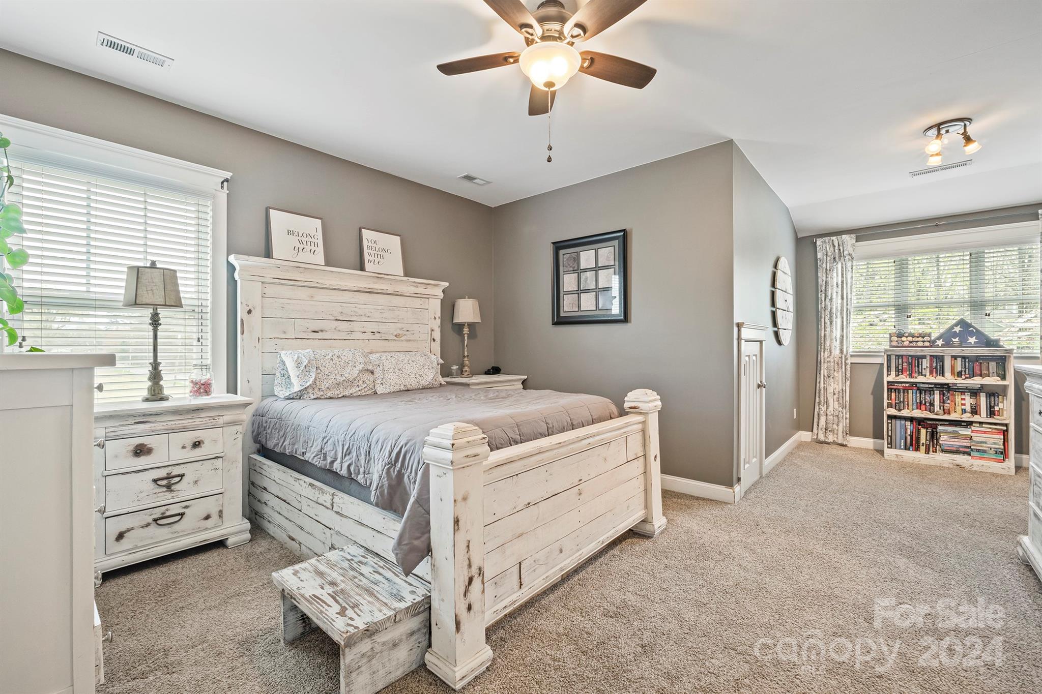 13516 Stumptown Road Huntersville, NC 28078 - Photo 25 of 37 a bedroom with a bed and a chandelier