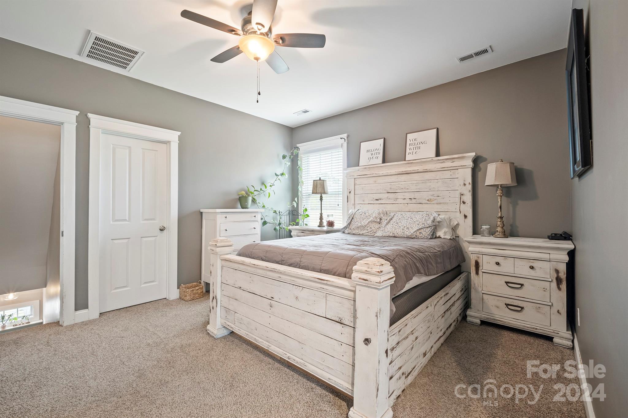 13516 Stumptown Road Huntersville, NC 28078 - Photo 26 of 37 a bedroom with a bed and a chandelier