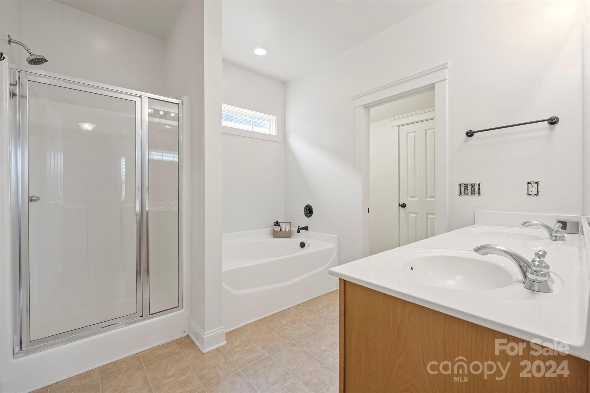 13516 Stumptown Road Huntersville, NC 28078 - Photo 31 of 37 a spacious bathroom with a tub shower and a sink