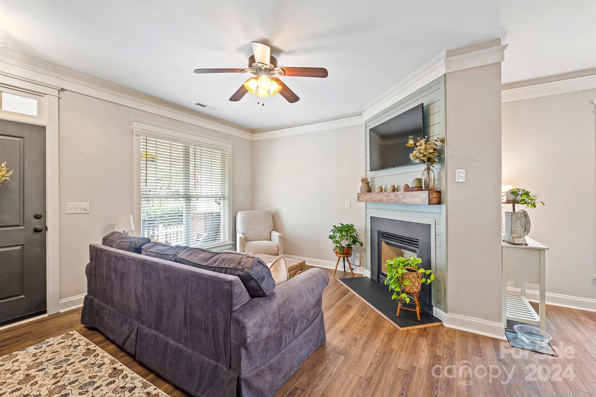 13516 Stumptown Road Huntersville, NC 28078 - Photo 4 of 37 a living room with furniture and a flat screen tv