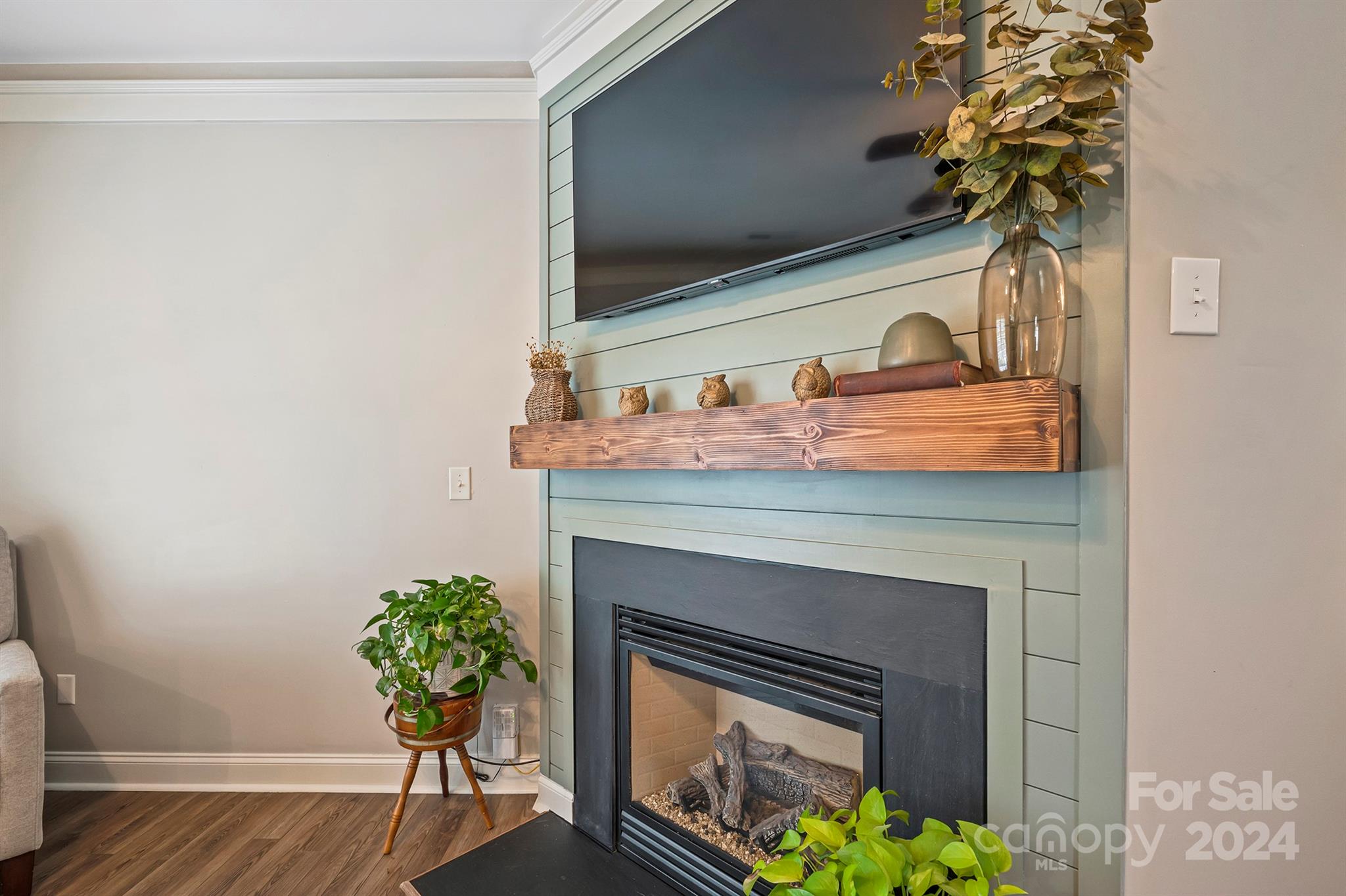 13516 Stumptown Road Huntersville, NC 28078 - Photo 7 of 37 a closeup of a fireplace with wooden floor