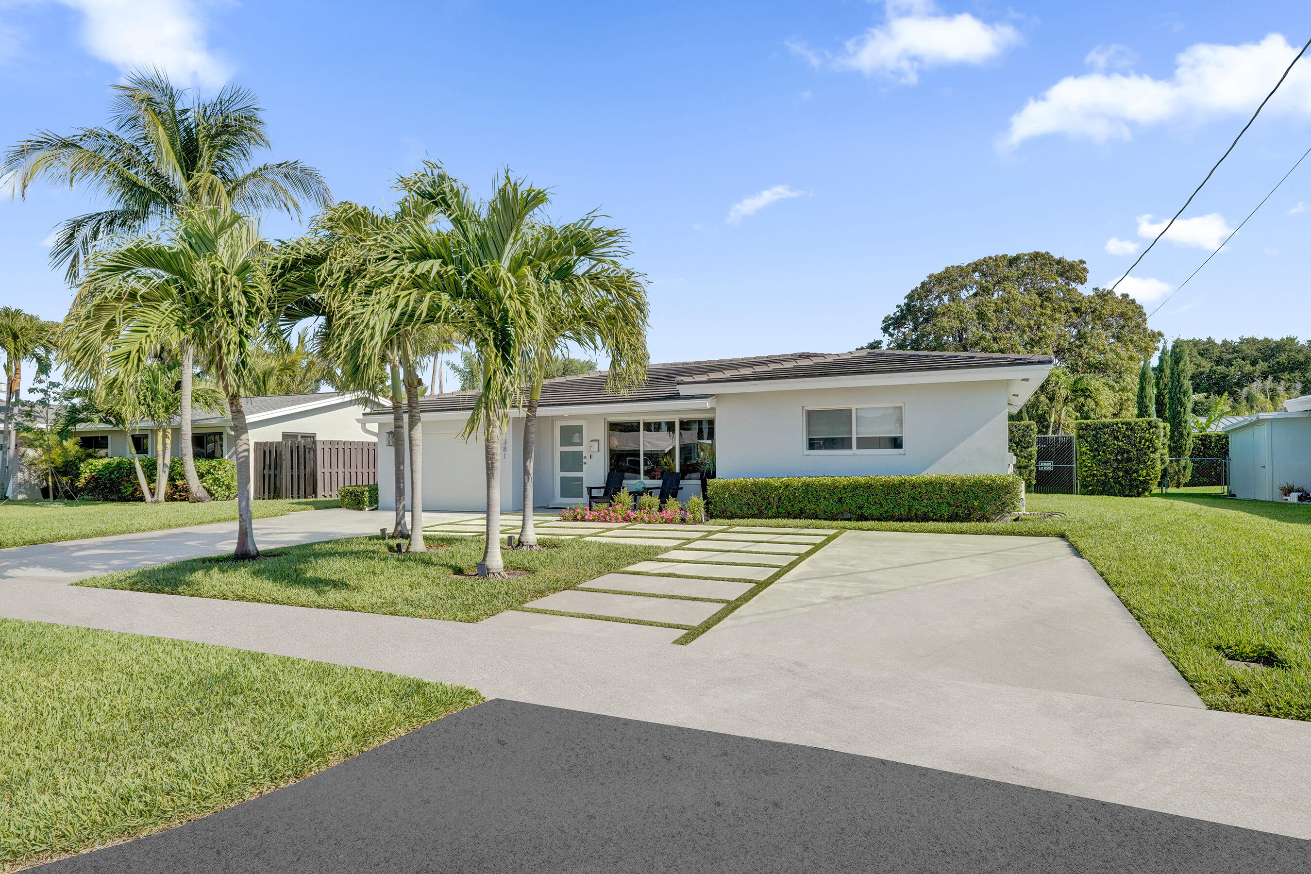381 Southeast 3rd Street Pompano Beach, FL 33060 - Photo 41 of 41 a house with palm tree in front of it