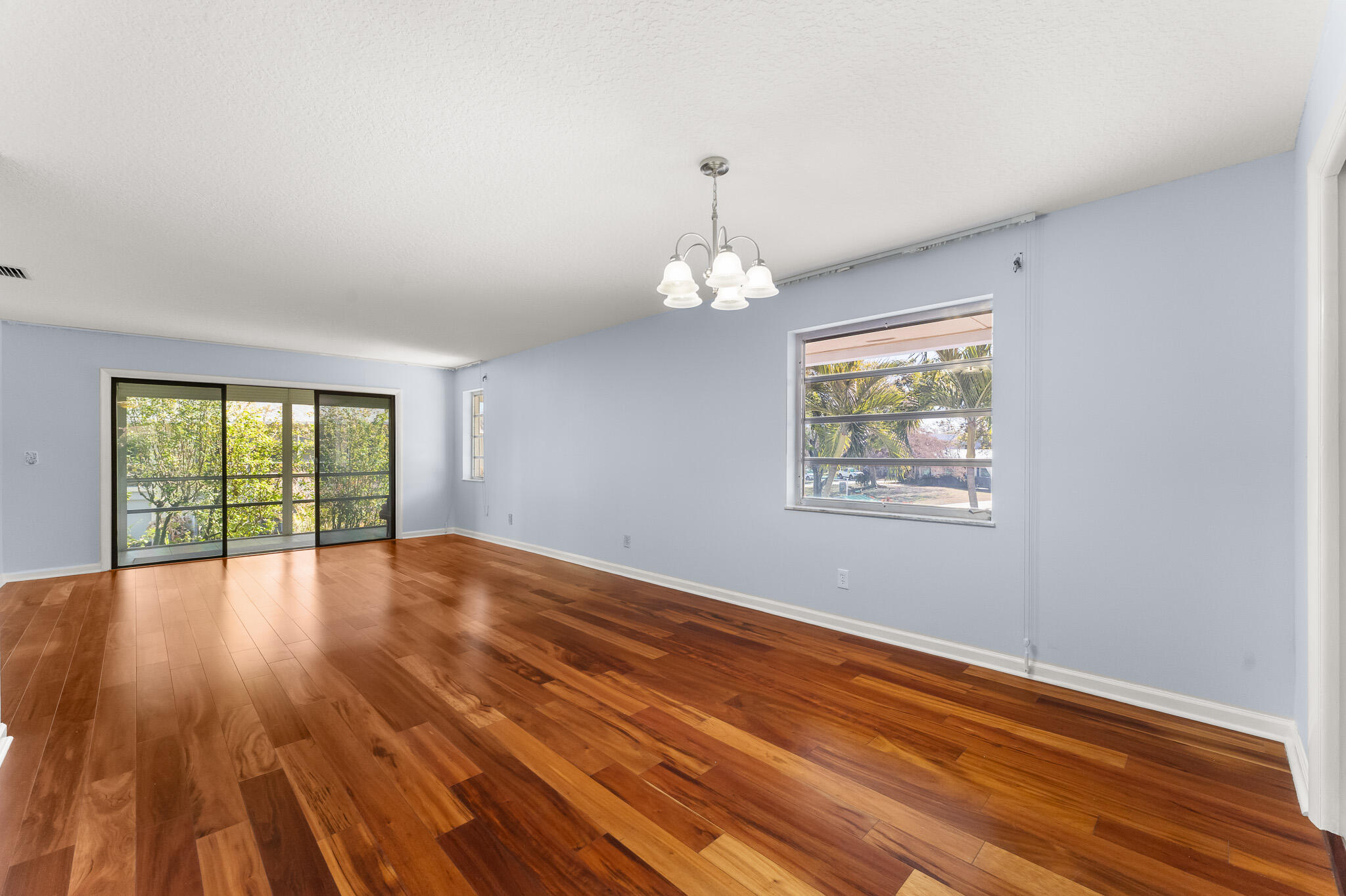 939 Northwest 11th Terrace, Unit 4 Stuart, FL 34994 - Photo 6 of 44 File.5 Living Facing Back Patio