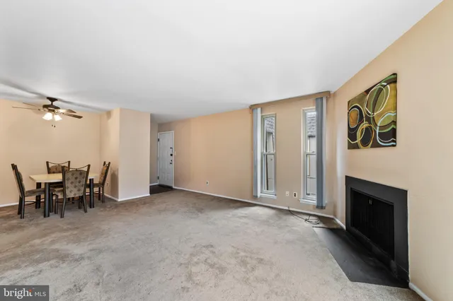 a view of a livingroom with furniture and a fireplace
