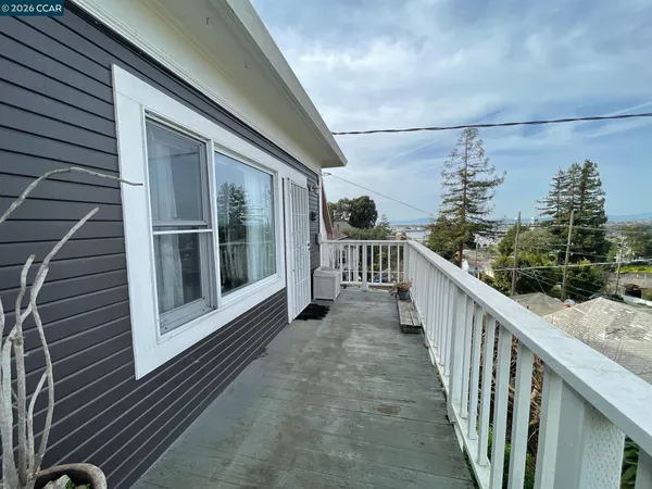 a view of a balcony with wooden floor