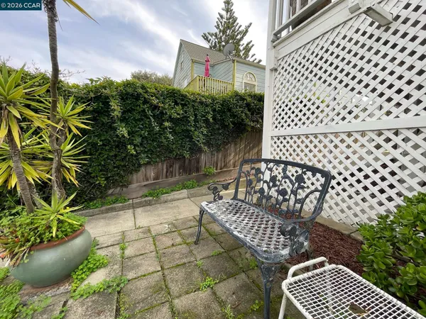 a view of a chairs and table in the patio