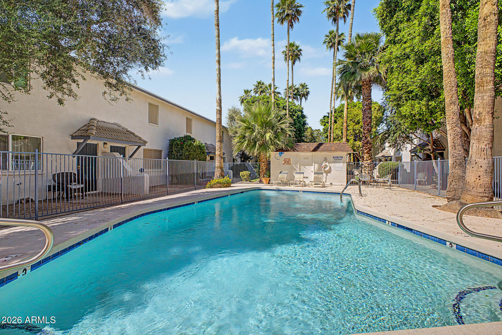 1531 West Colter Street, Unit 1 Phoenix, AZ 85015 - Photo 14 of 22 a view of a swimming pool with a patio