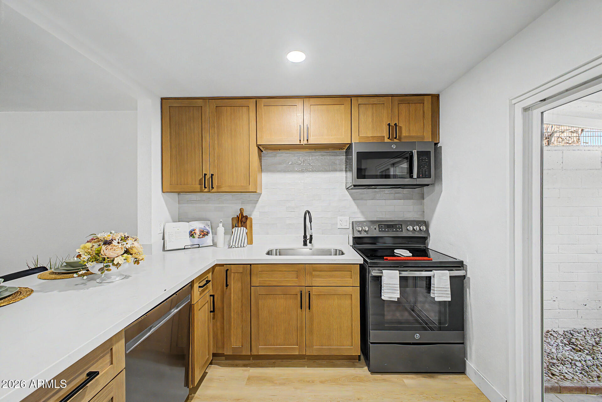 1531 West Colter Street, Unit 1 Phoenix, AZ 85015 - Photo 5 of 22 a kitchen with a sink stove and microwave