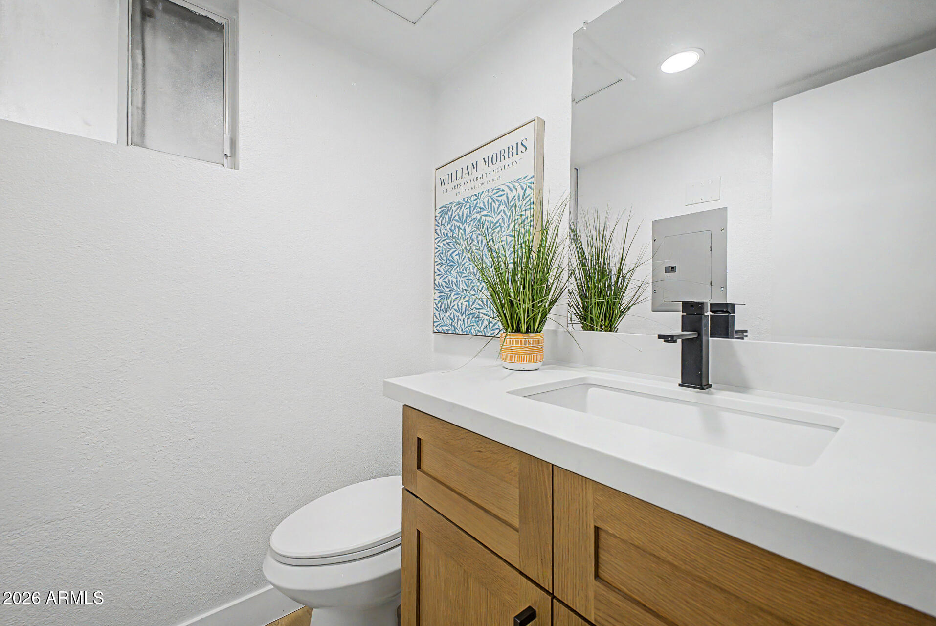 1531 West Colter Street, Unit 1 Phoenix, AZ 85015 - Photo 7 of 22 a bathroom with a sink a toilet and mirror