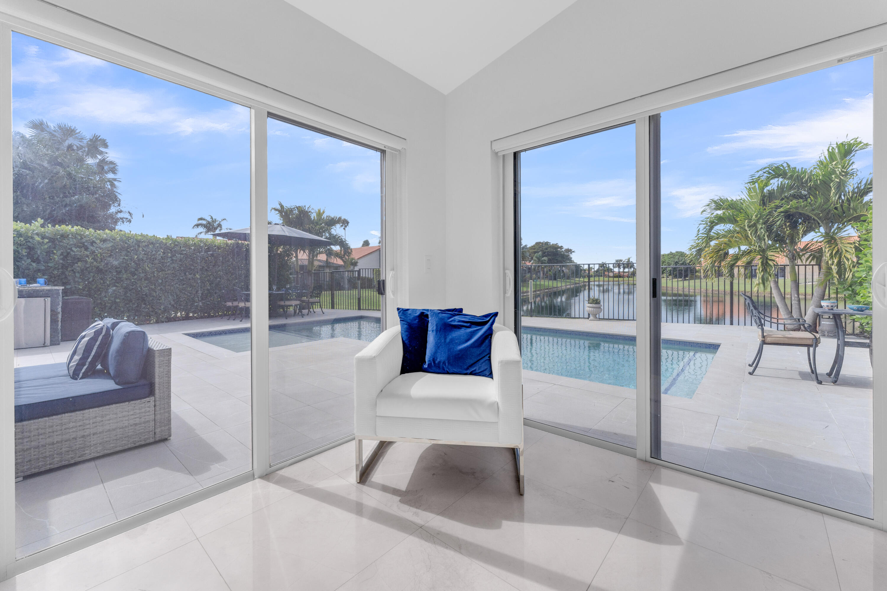 8024 Copenhagen Way Boca Raton, FL 33434 - Photo 27 of 69 a living room with furniture and a floor to ceiling window