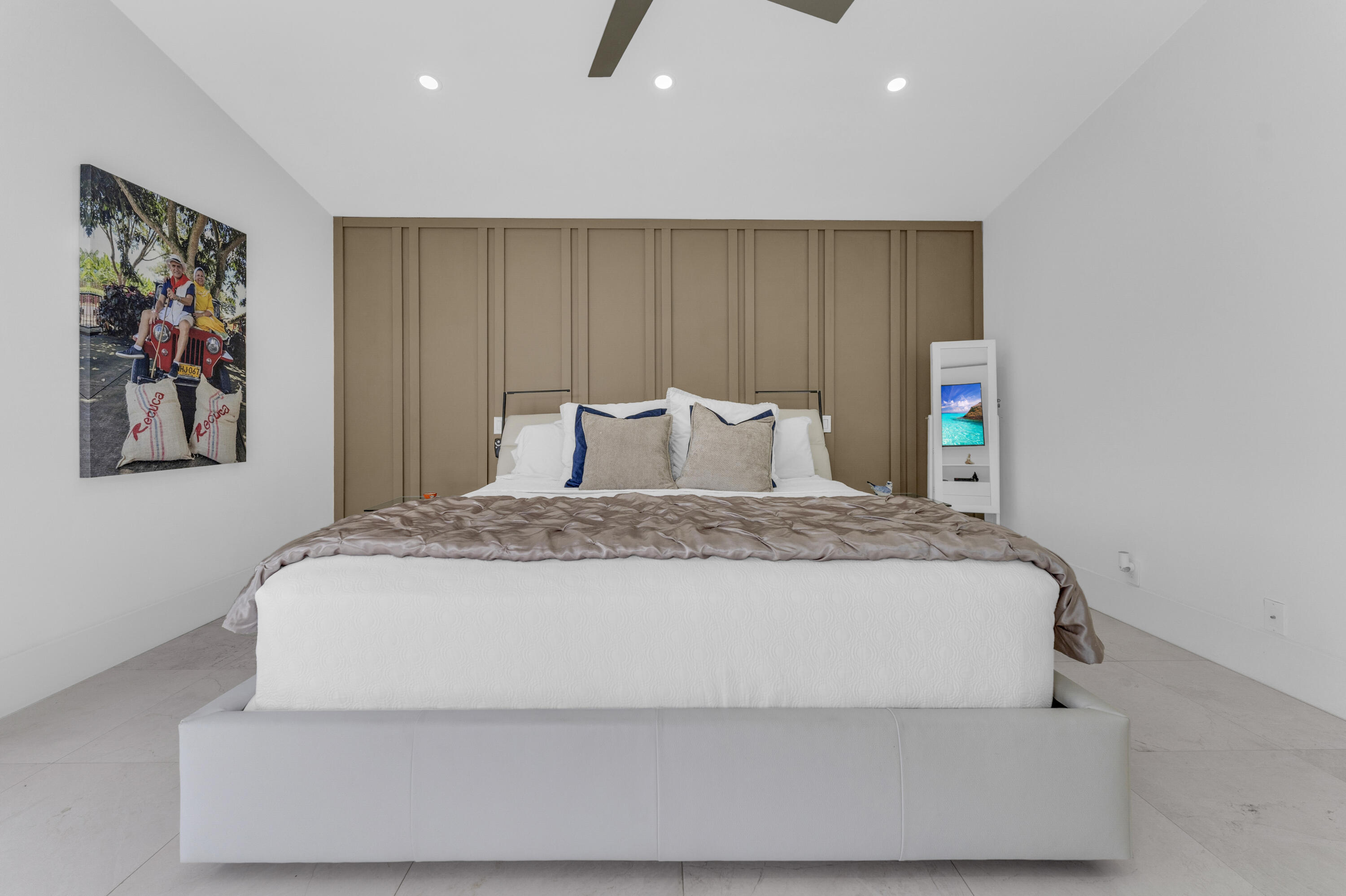 8024 Copenhagen Way Boca Raton, FL 33434 - Photo 30 of 69 a bedroom with a large bed and a painting on the wall