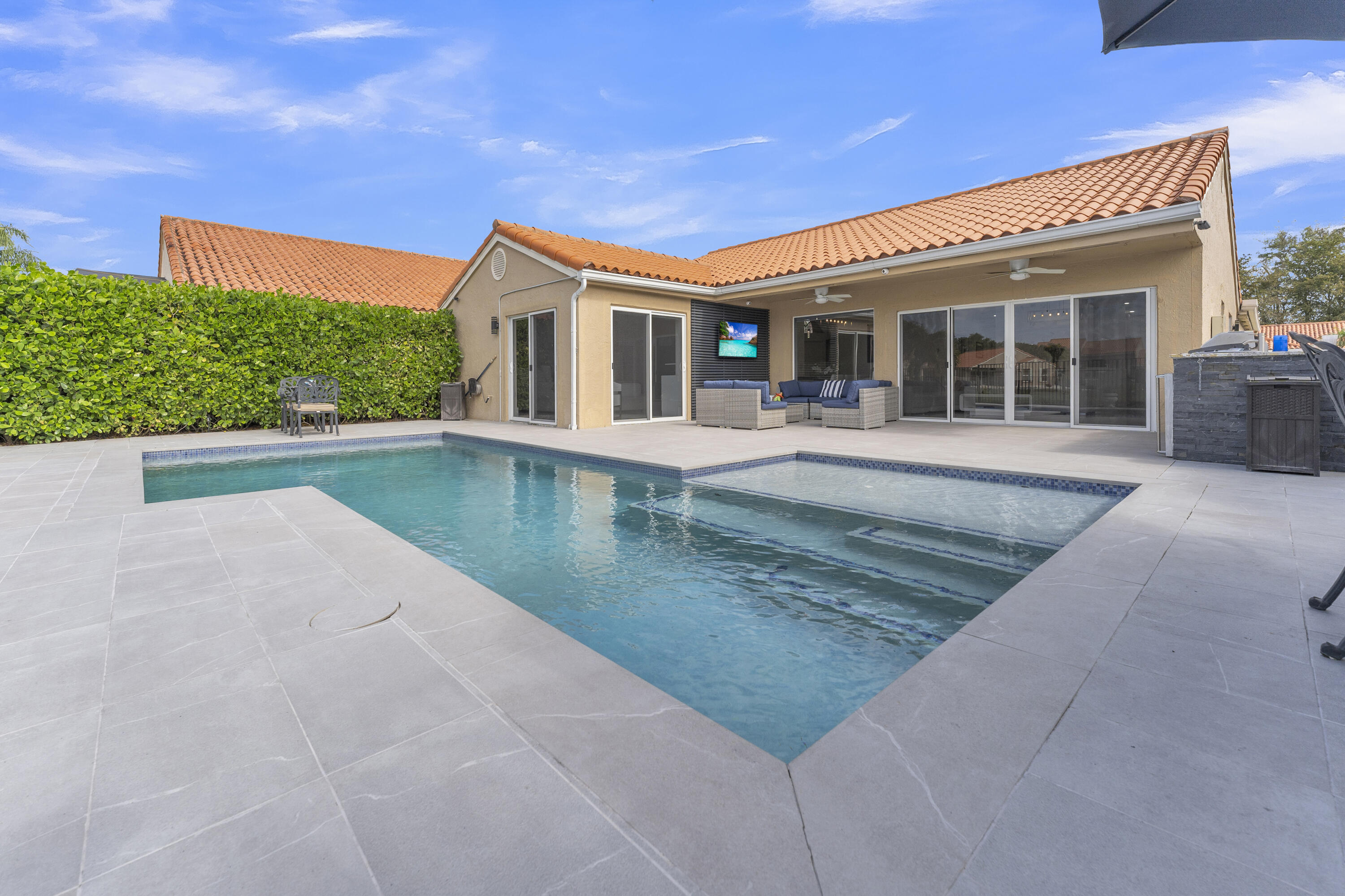 8024 Copenhagen Way Boca Raton, FL 33434 - Photo 44 of 69 front view of a house with a yard
