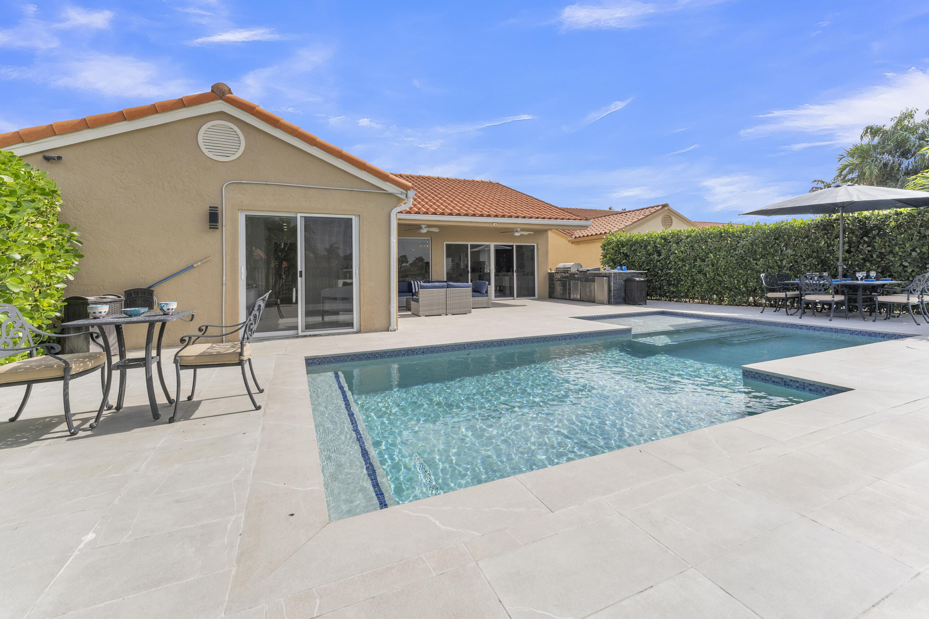 8024 Copenhagen Way Boca Raton, FL 33434 - Photo 50 of 69 a front view of house with yard and outdoor seating
