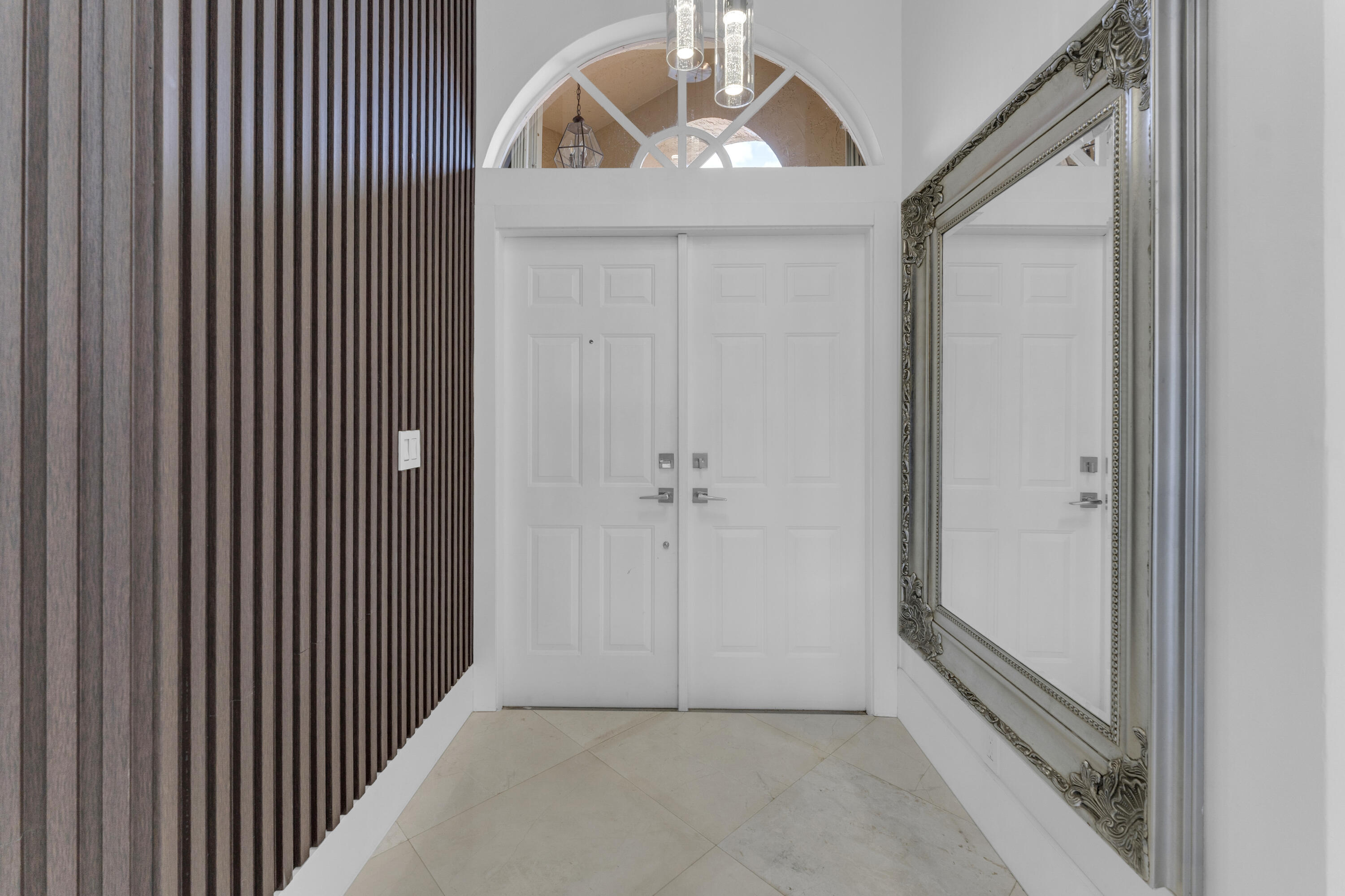 8024 Copenhagen Way Boca Raton, FL 33434 - Photo 6 of 69 a view of a hallway with wooden floor and entryway