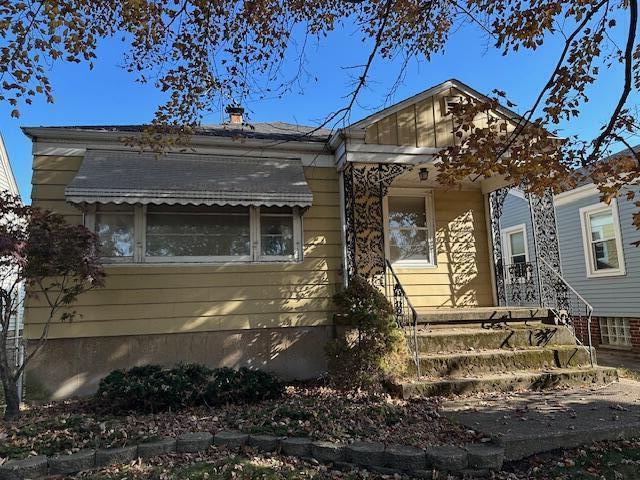 1717 Warwick Avenue Whiting, IN 46394 - Photo 1 of 17 a front view of a house with a yard