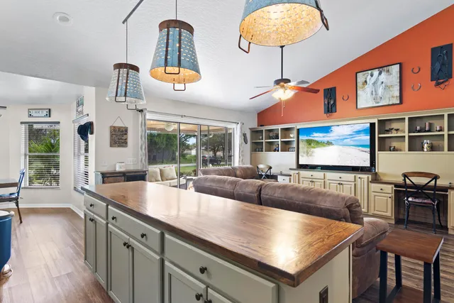 a kitchen with stainless steel appliances granite countertop a stove and a sink