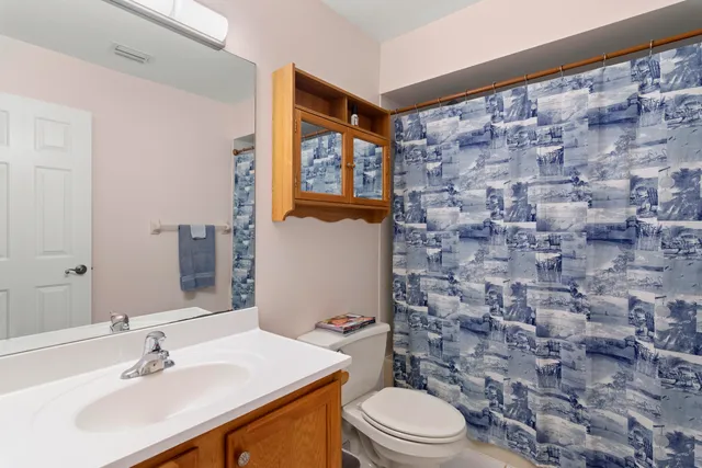 an aerial view of a house with swimming pool outdoor seating and yard