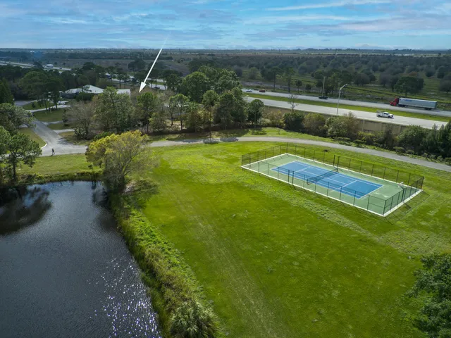 an aerial view of a house with yard swimming pool and outdoor seating