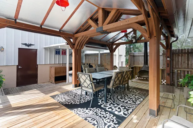 a view of a chairs and table in the patio