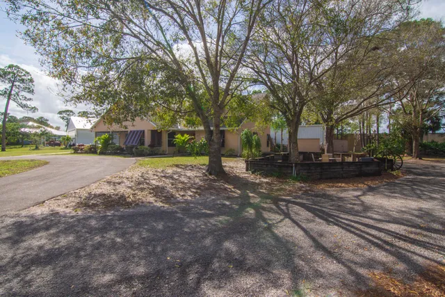 a view of a house with snow on the tree