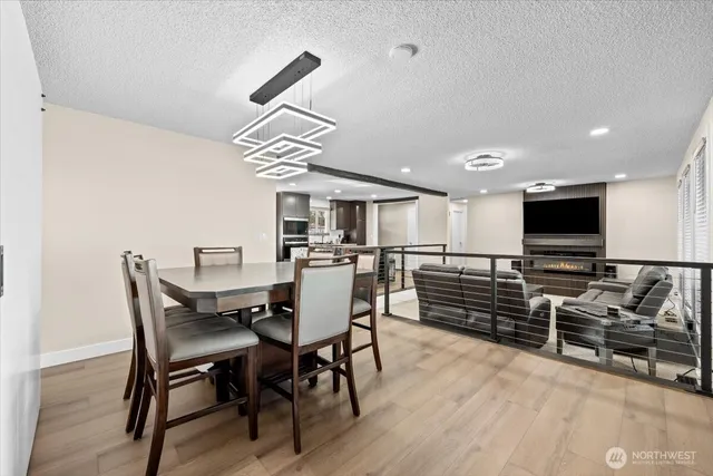 a living room with furniture pool and a flat screen tv
