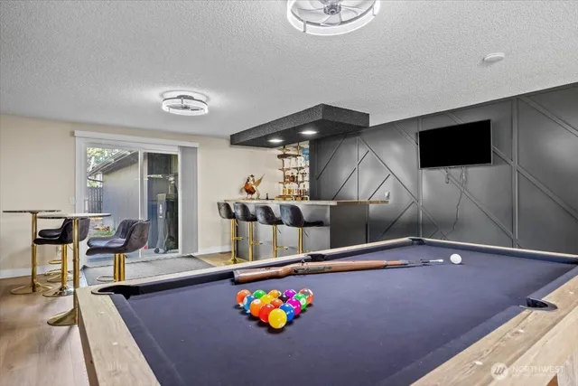 a kitchen with a sink appliances and a counter top