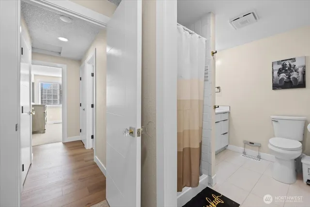 a bedroom with a large bed and a closet