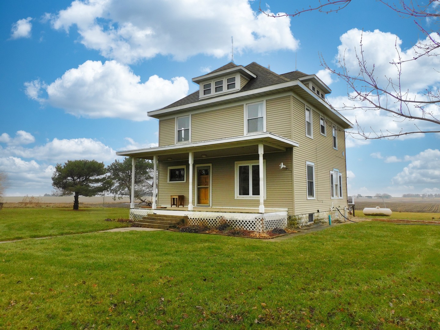 10797 West Fairmont Road Polo, IL 61064 - Photo 1 of 30 a front view of a house with garden