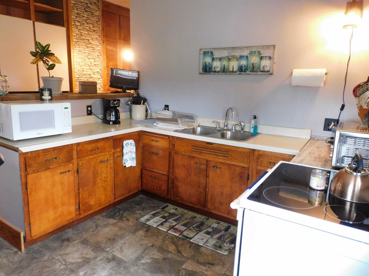 10797 West Fairmont Road Polo, IL 61064 - Photo 11 of 30 a kitchen with a sink stove and cabinets