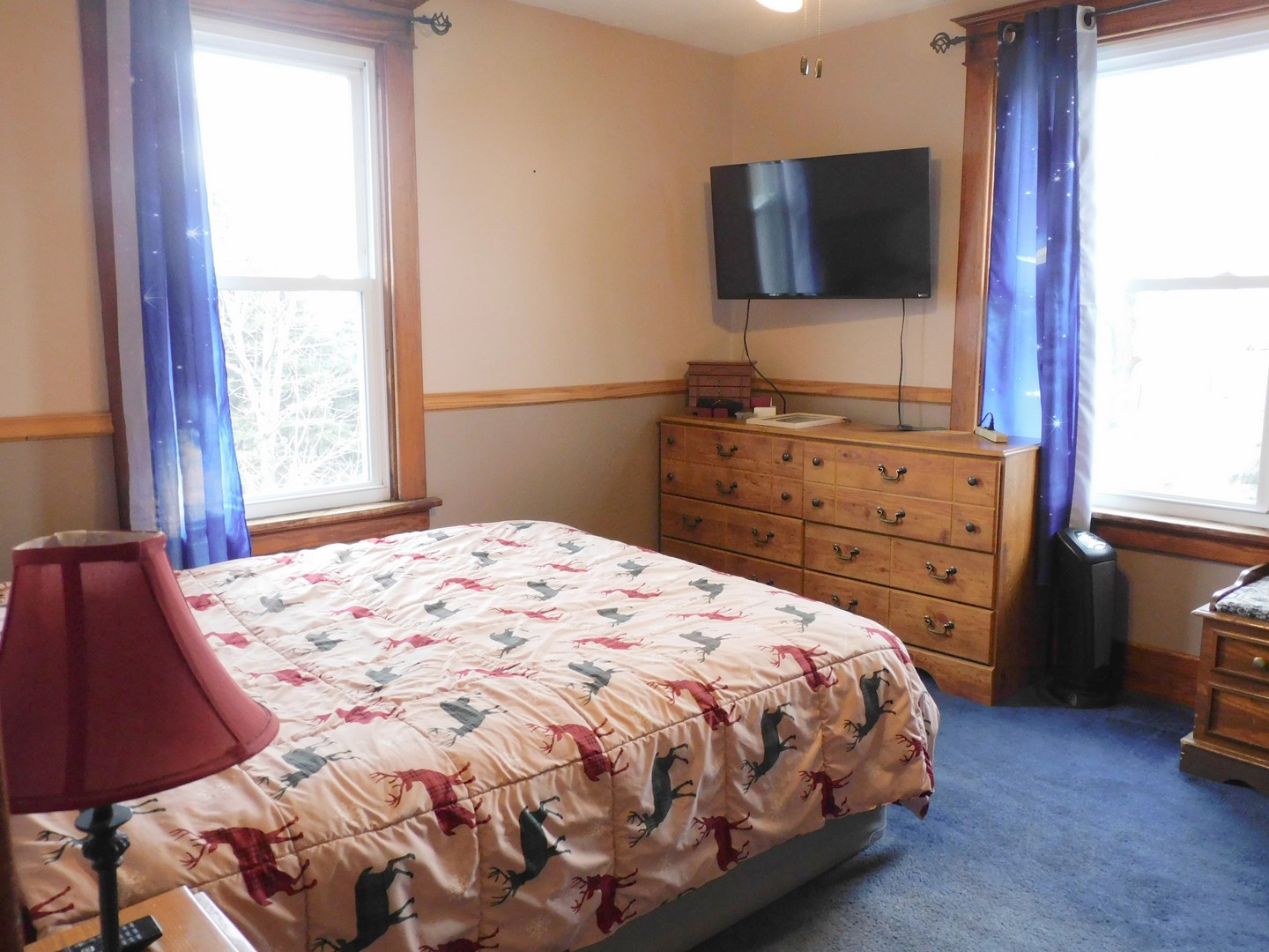 10797 West Fairmont Road Polo, IL 61064 - Photo 21 of 30 a bedroom with a bed and a flat screen tv
