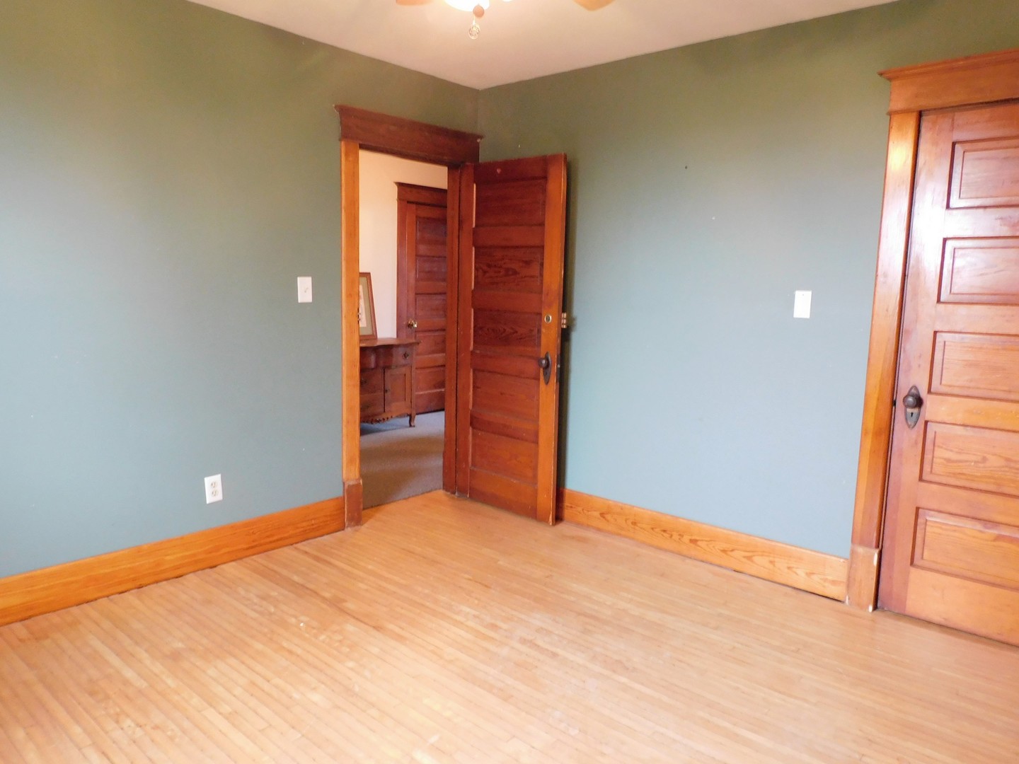 10797 West Fairmont Road Polo, IL 61064 - Photo 24 of 30 a view of an empty room with wooden floor and a window