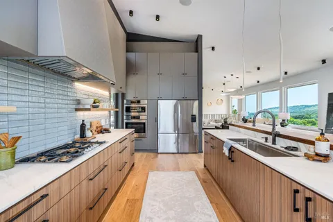 a bathroom with a toilet a sink and a mirror