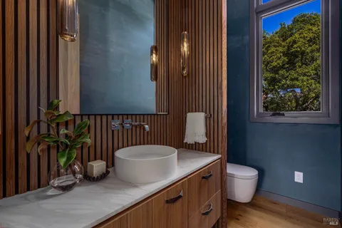 a bathroom with a sink a mirror and a bathtub