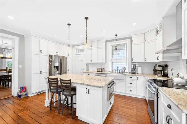a kitchen with a sink cabinets and window