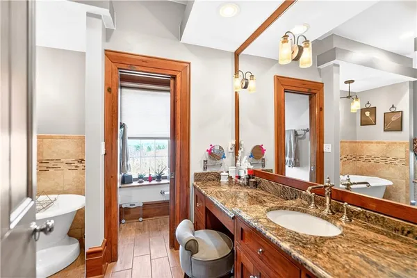 a room with a table chairs and entryway