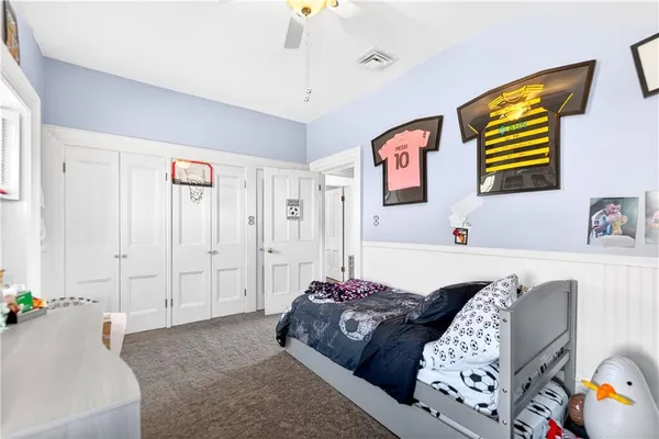 a bedroom with furniture and a chandelier