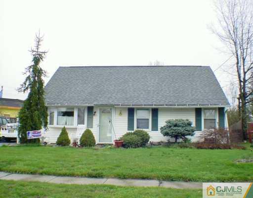 136 Idlewild Road Edison, NJ 08817 - Photo 1 of 2 a front view of a house with a garden