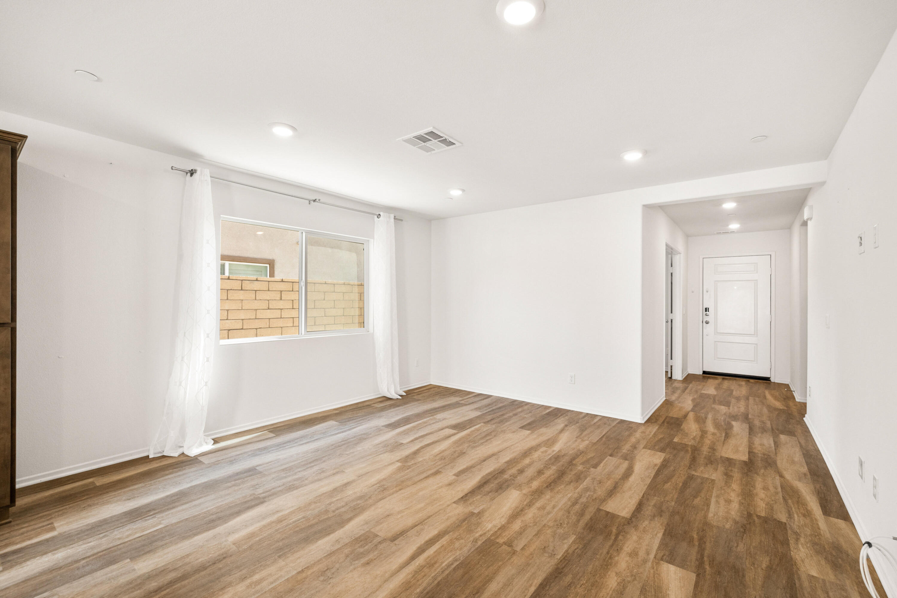 67364 Rio Plata Road Cathedral City, CA 92234 - Photo 11 of 49 a view of empty room with wooden floor and fan
