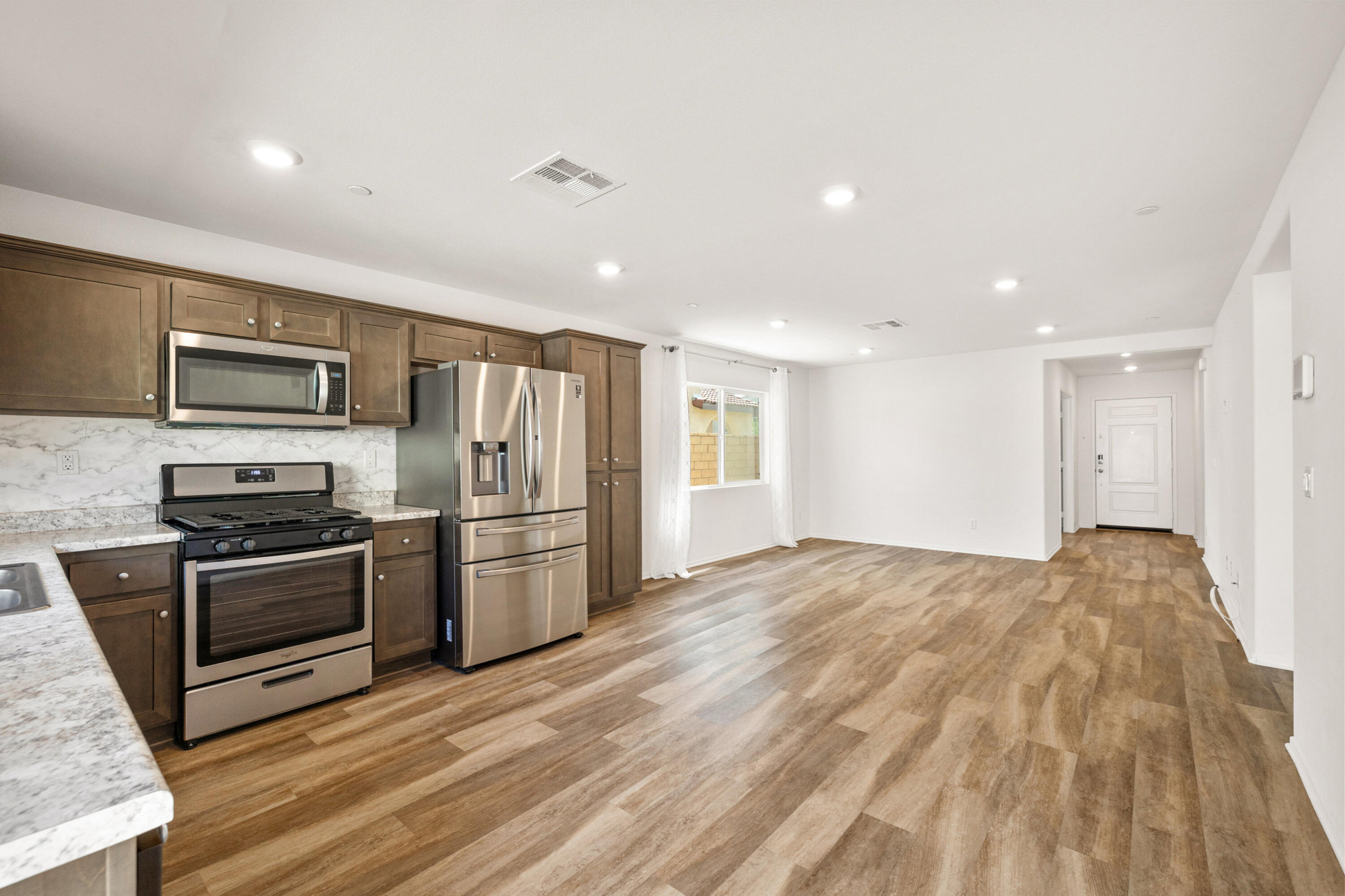 67364 Rio Plata Road Cathedral City, CA 92234 - Photo 15 of 49 a kitchen with refrigerator a stove top oven a sink and dishwasher