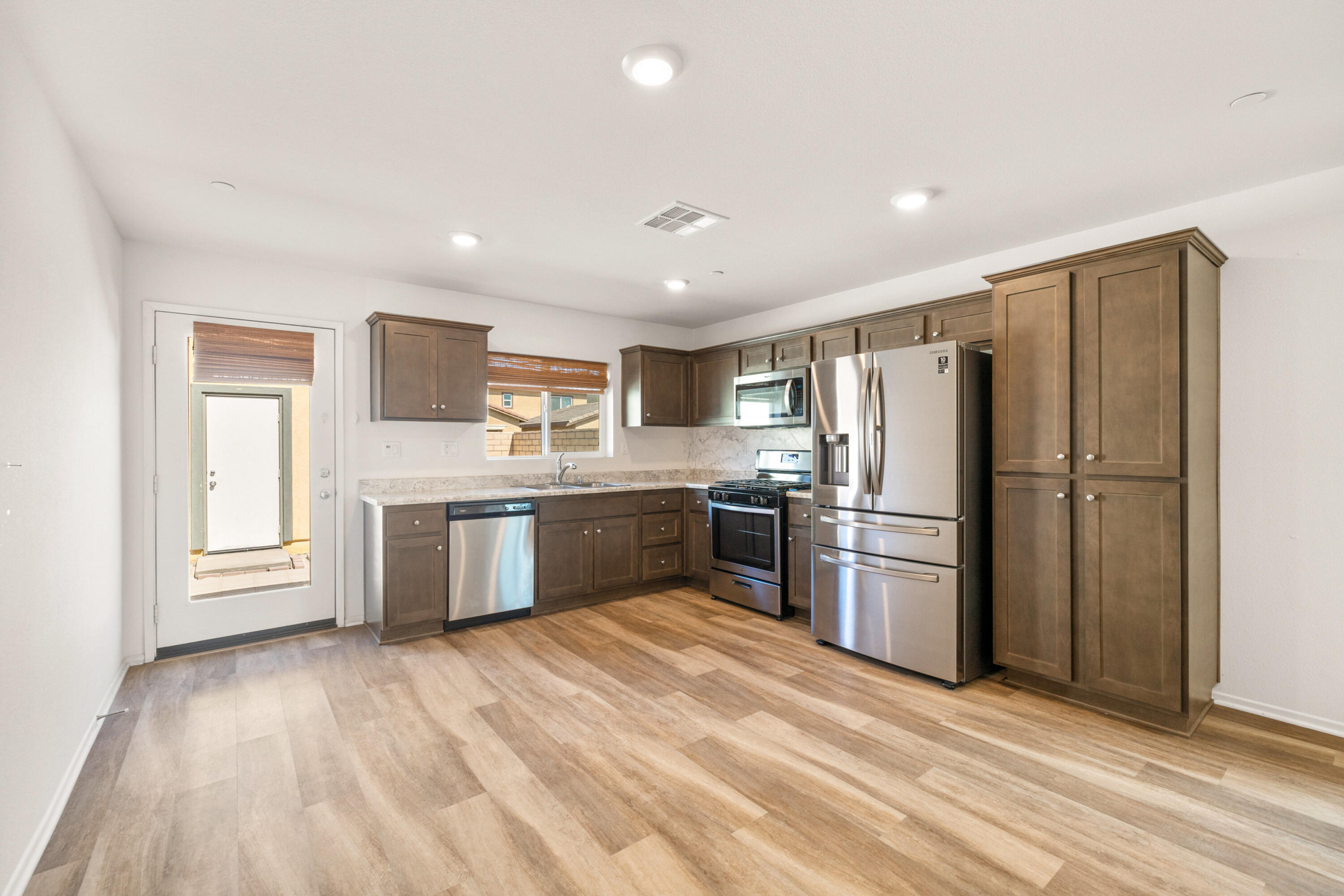 67364 Rio Plata Road Cathedral City, CA 92234 - Photo 16 of 49 a kitchen with stainless steel appliances a refrigerator and a stove top oven