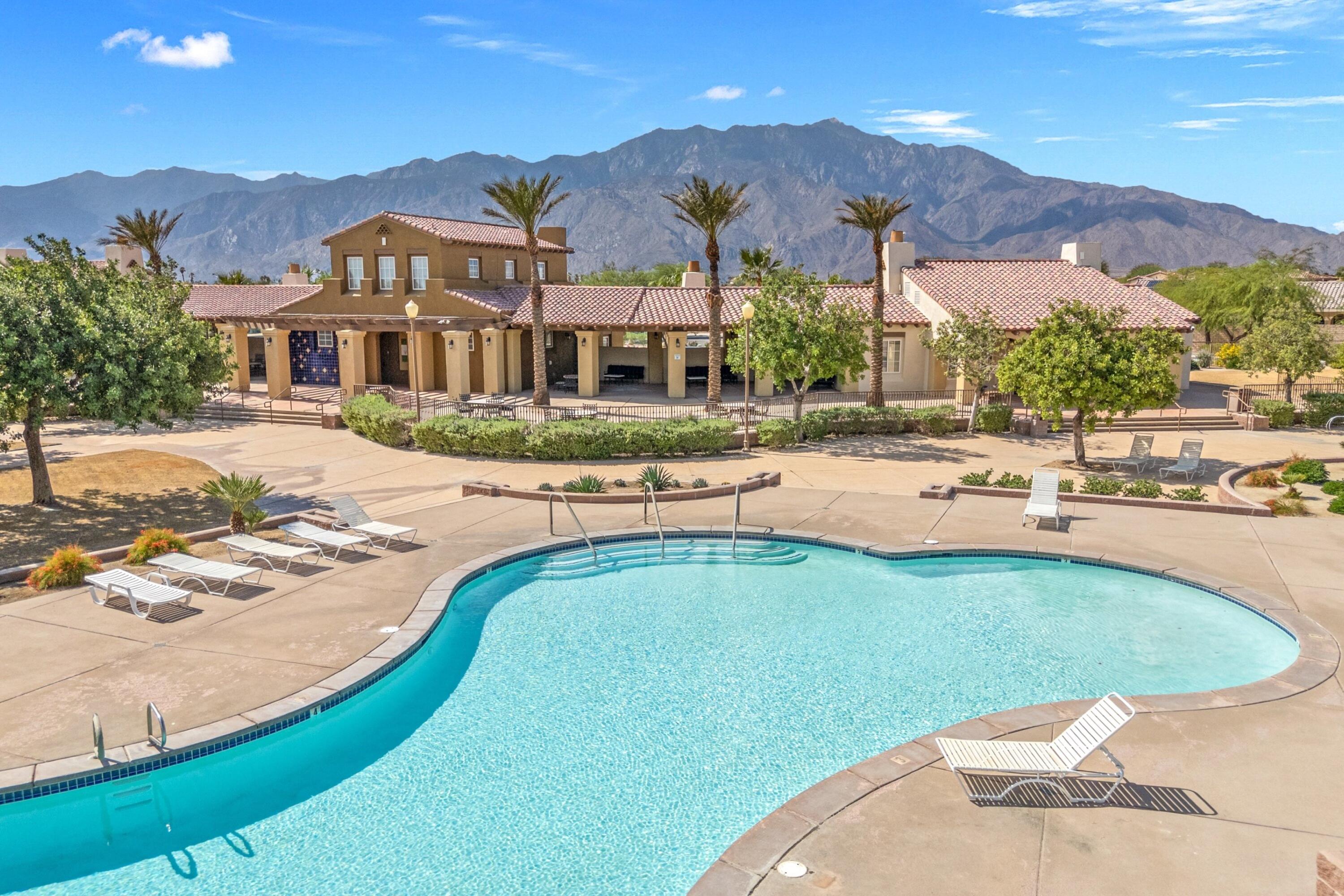67364 Rio Plata Road Cathedral City, CA 92234 - Photo 2 of 49 a view of a house with swimming pool and mountains
