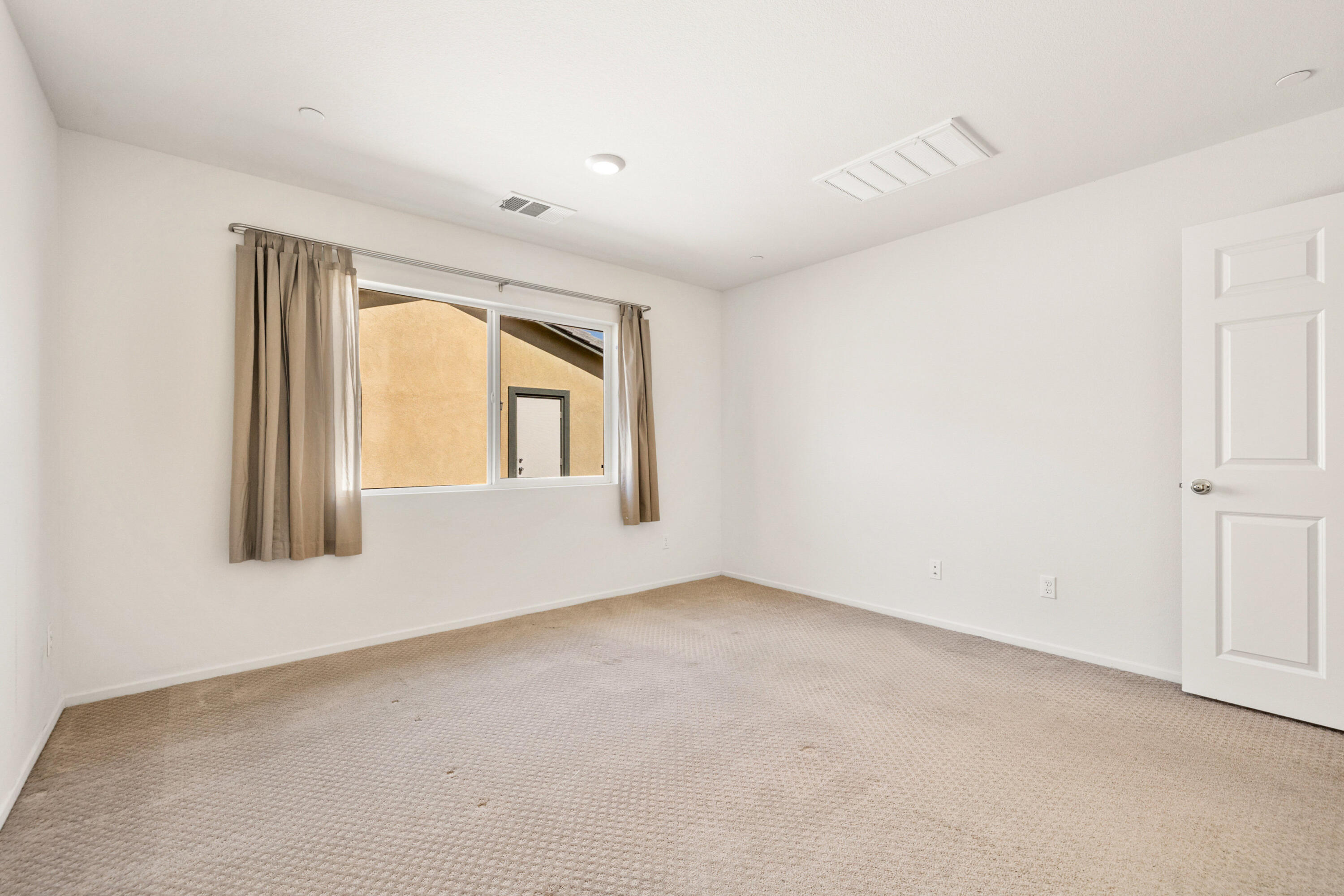 67364 Rio Plata Road Cathedral City, CA 92234 - Photo 21 of 49 an empty room with a window