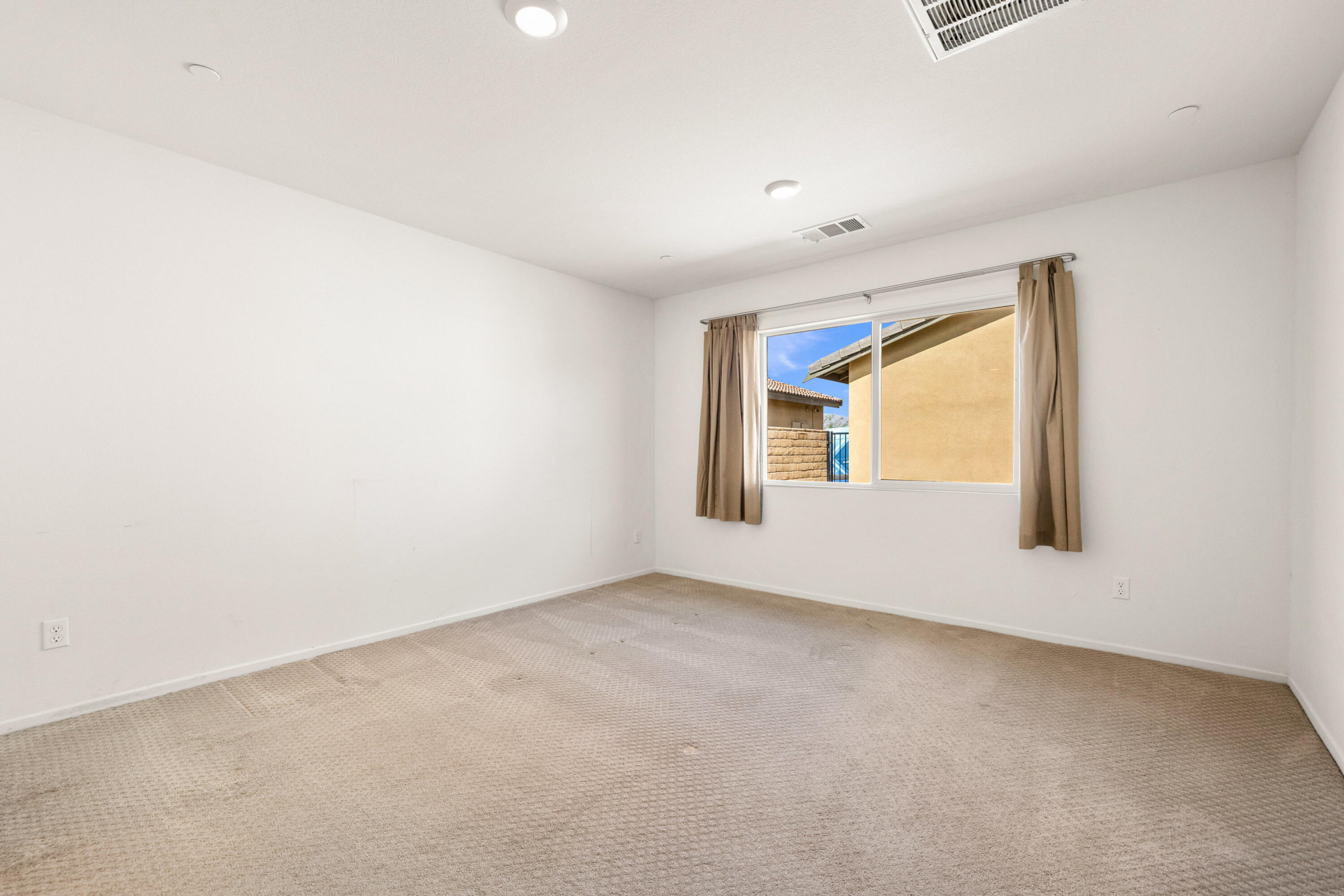 67364 Rio Plata Road Cathedral City, CA 92234 - Photo 25 of 49 an empty room with a window