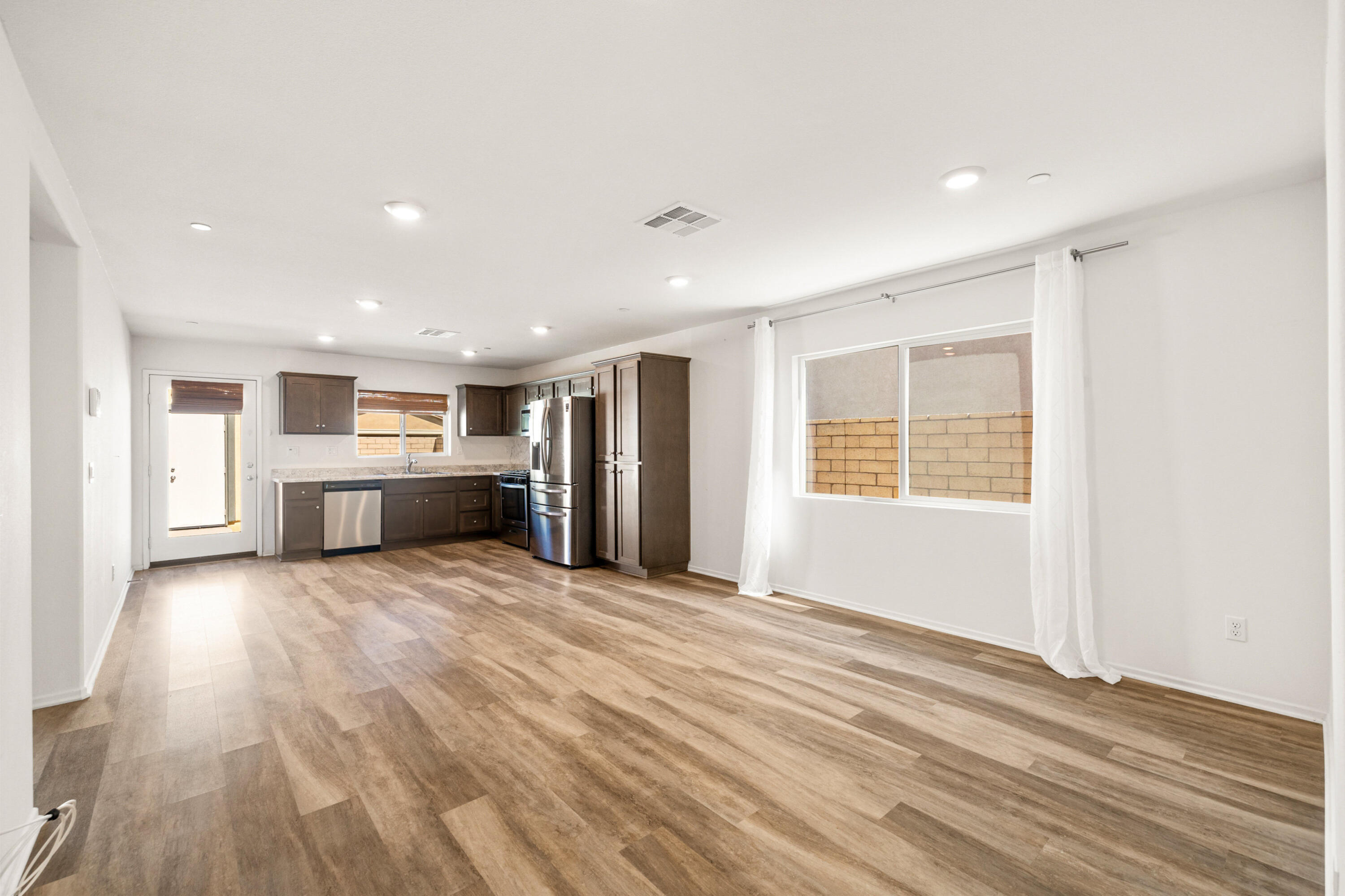 67364 Rio Plata Road Cathedral City, CA 92234 - Photo 27 of 49 a view of an empty room with kitchen and window