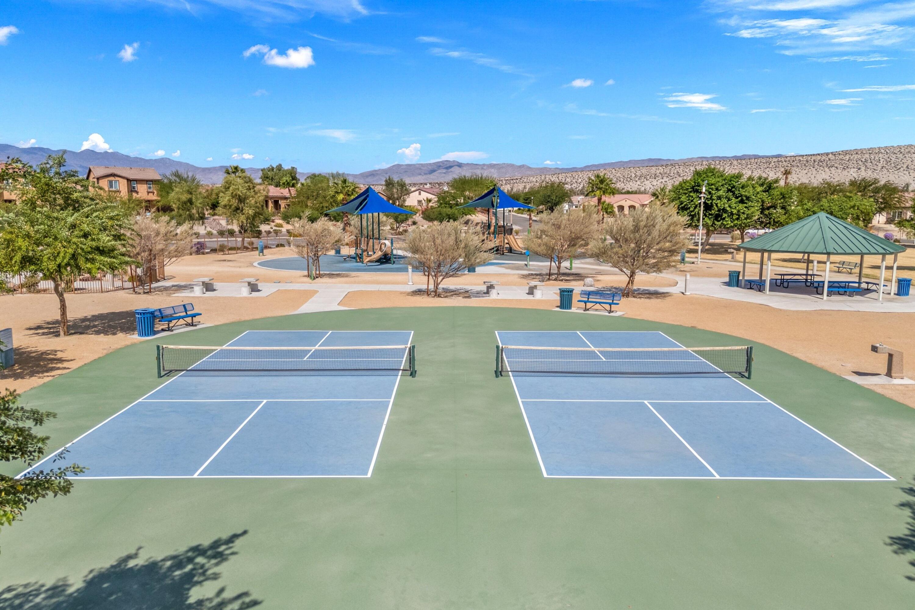 67364 Rio Plata Road Cathedral City, CA 92234 - Photo 3 of 49 a view of a swimming pool with an outdoor seating a yard and mountain view