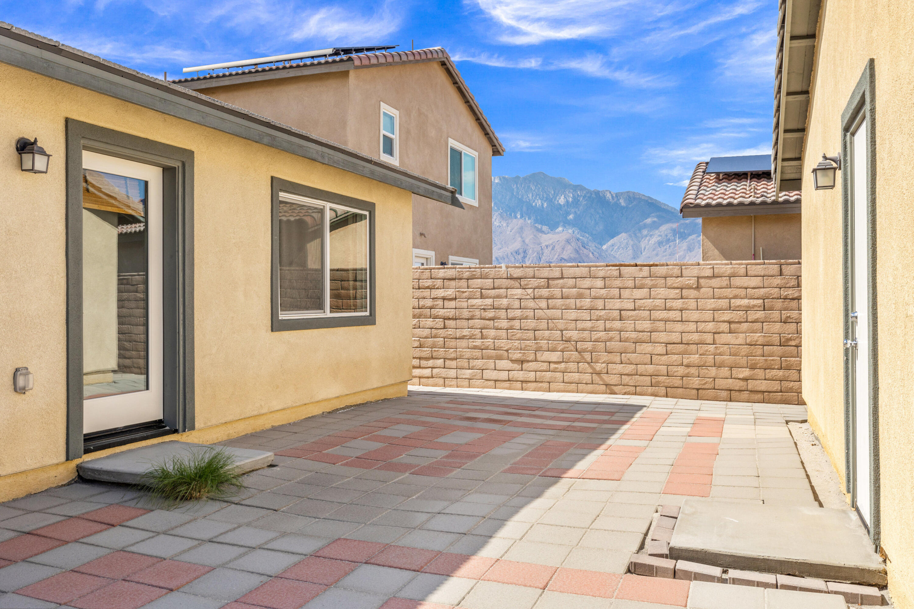 67364 Rio Plata Road Cathedral City, CA 92234 - Photo 40 of 49 a view of a brick house with many windows
