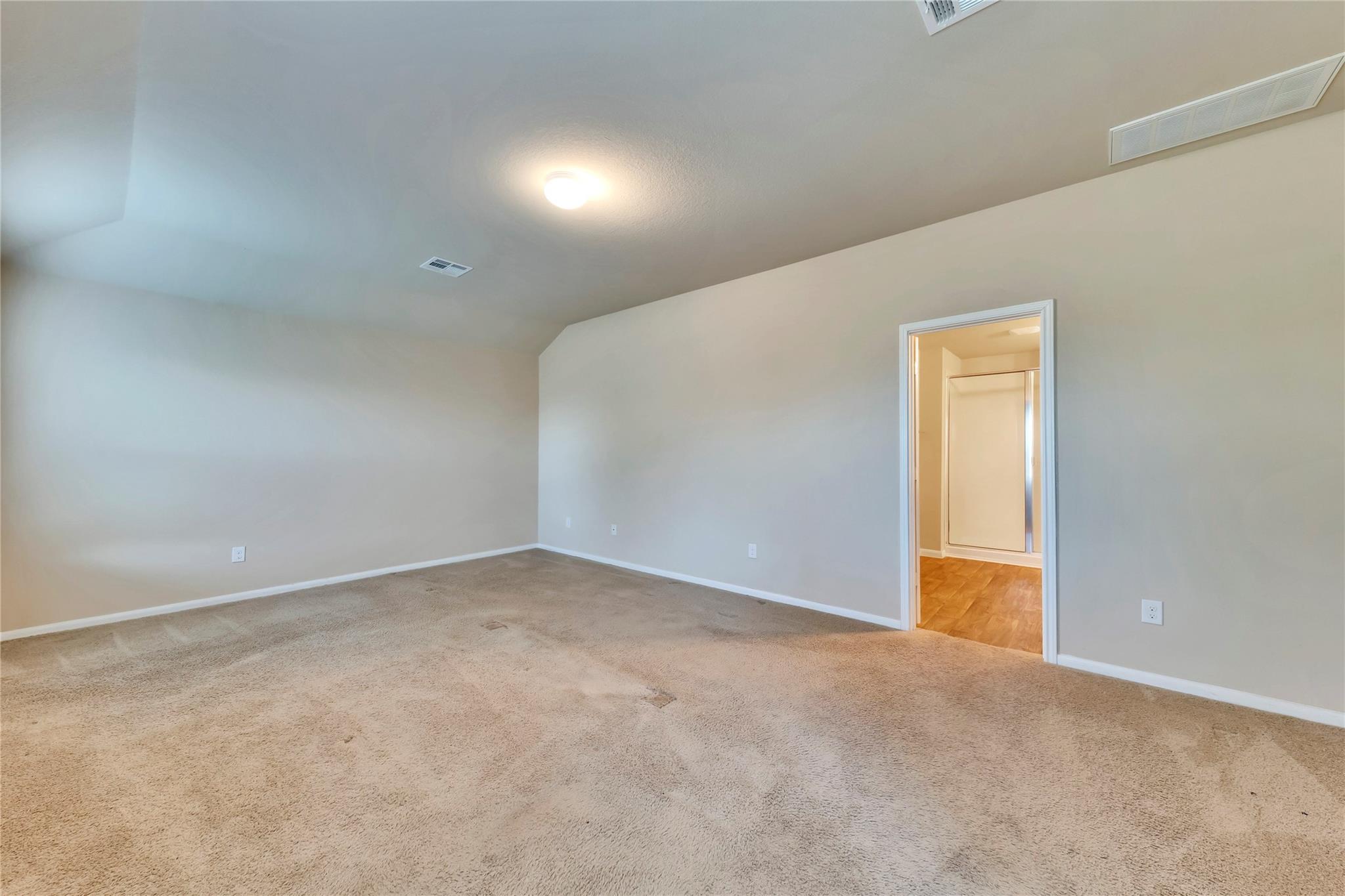 5913 Diamondleaf Bend Austin, TX 78724 - Photo 17 of 20 Spacious room featuring neutral carpet flooring and light-toned wall paint