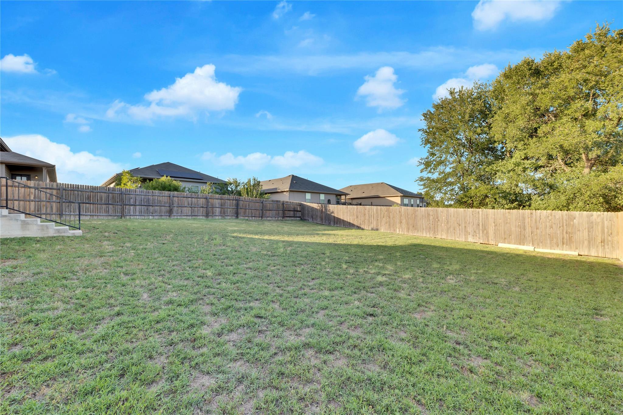 5913 Diamondleaf Bend Austin, TX 78724 - Photo 19 of 20 Generous backyard with a vast grassy expanse