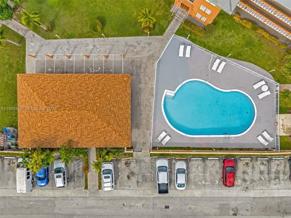 an aerial view of residential building and lake